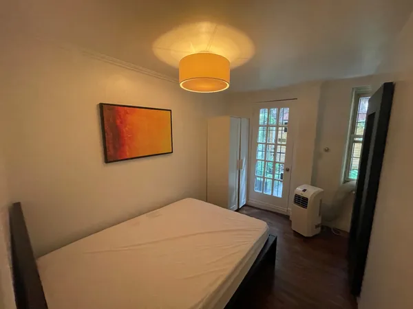 a view of a golf course with chairs in patio