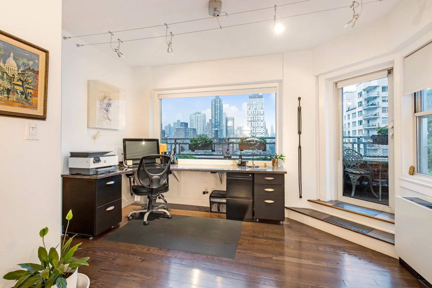 520 East 76th Street, Unit PHC Manhattan, NY 10021 - Photo 9 of 15 a view of a workspace with furniture and a window