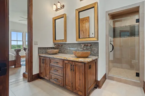 a view of a balcony with chairs and wooden floor
