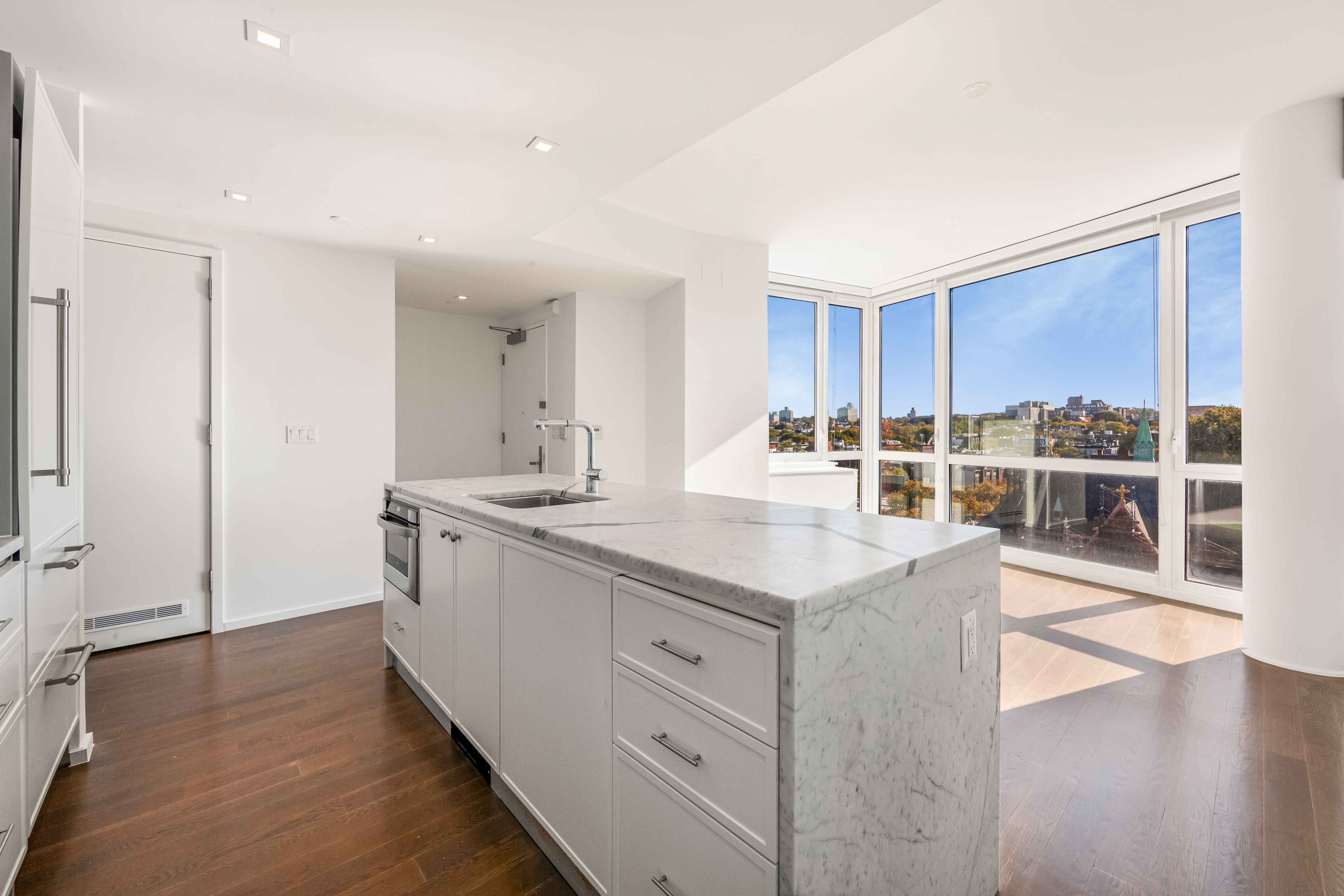 202 8th Street, Unit 8A Brooklyn, NY 11215 - Photo 2 of 21 a kitchen with stainless steel appliances granite countertop a sink stove and wooden floor
