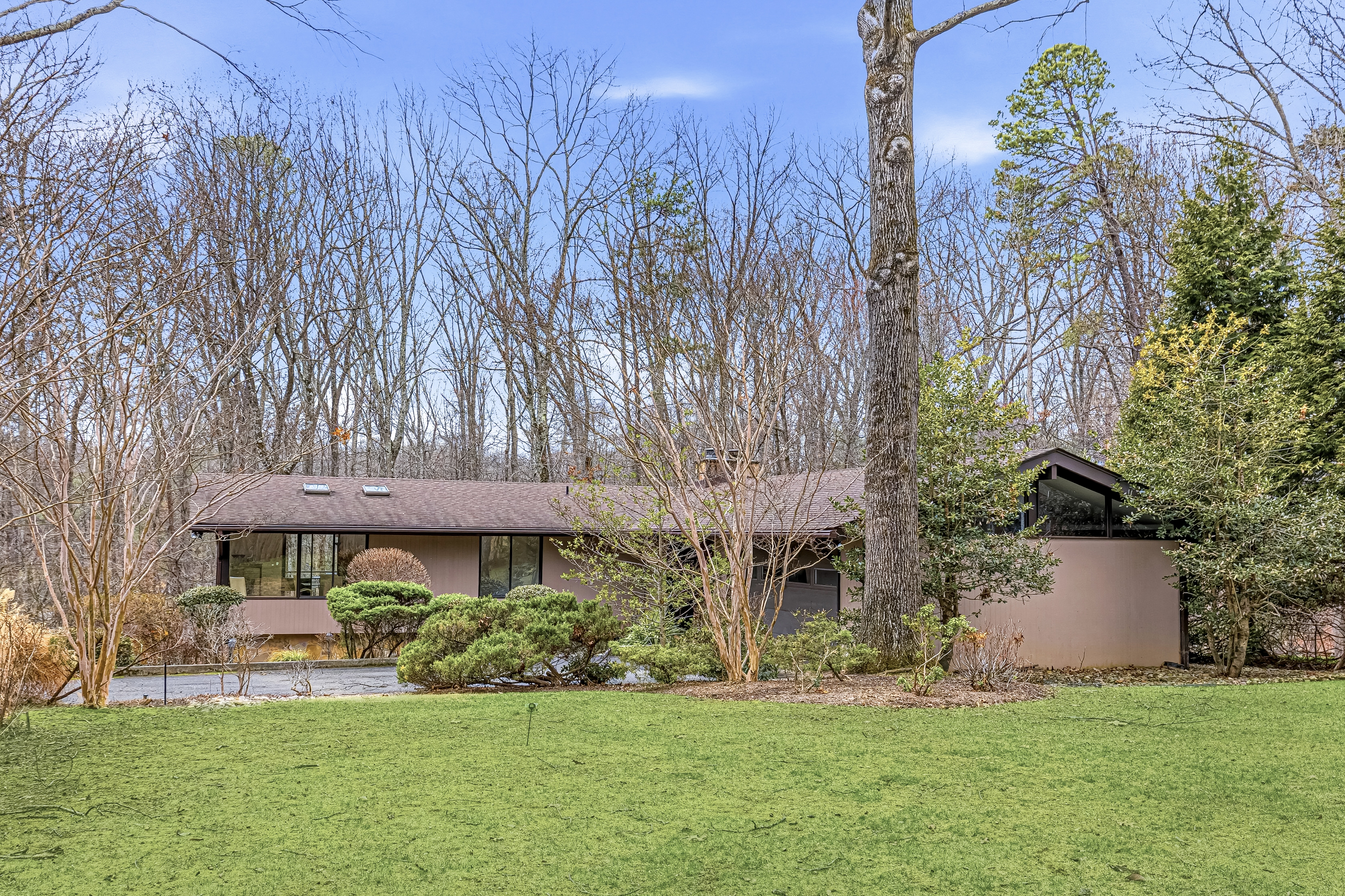 Hunter Station Road Vienna, VA 22181 - Photo 11 of 13 a front view of a house with a garden and trees