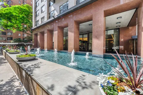 a view of a house with backyard and porch