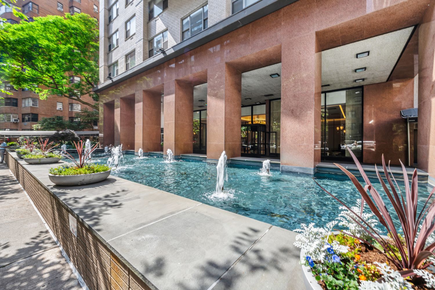 400 East 56th Street, Unit 19O Manhattan, NY 10022 - Photo 18 of 20 a view of a house with backyard and porch