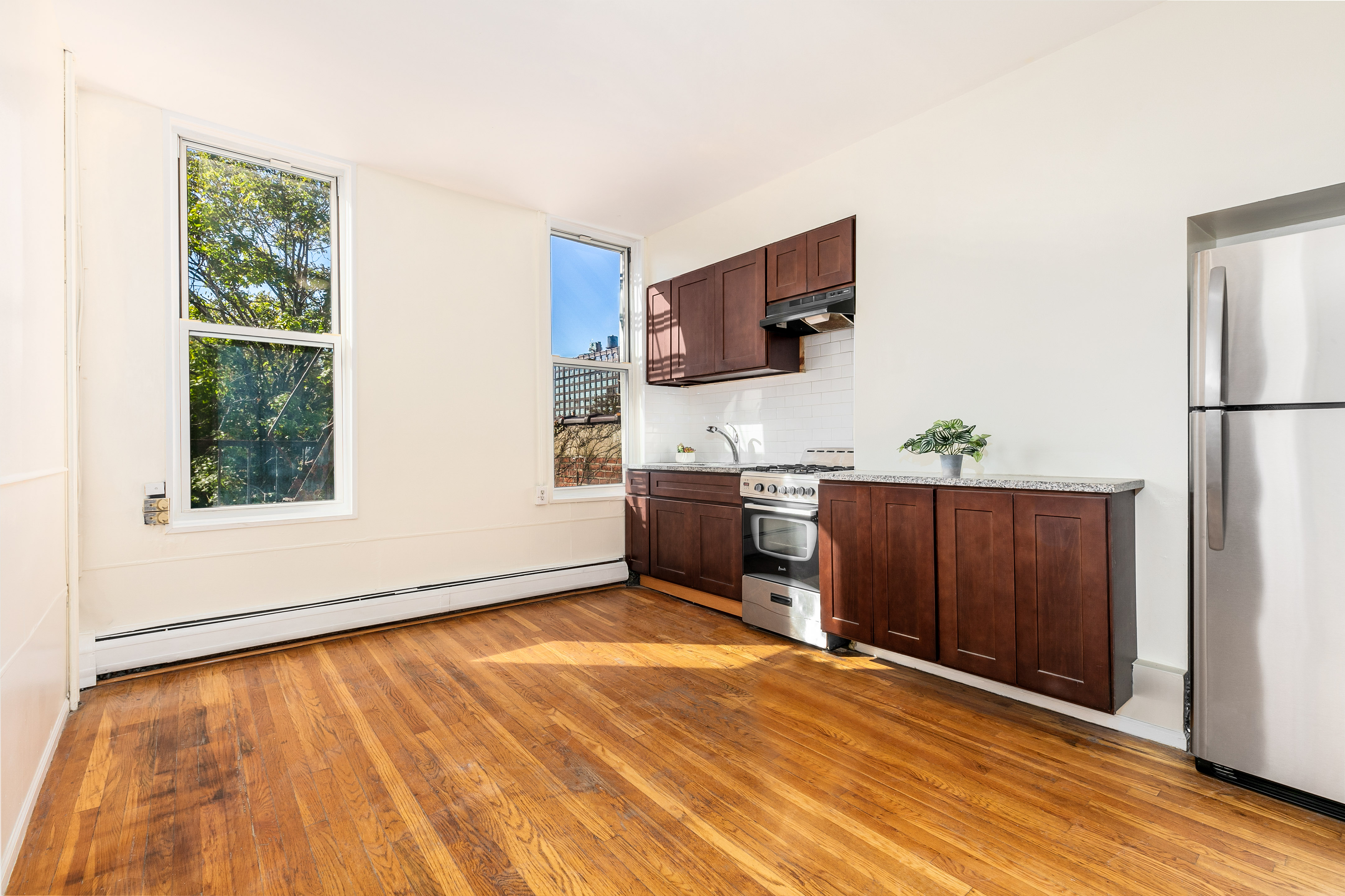 148 29th Street Brooklyn, NY 11232 - Photo 13 of 31 a view of a kitchen with microwave and cabinets