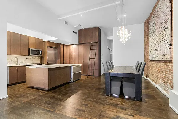 a view of kitchen with sink microwave and refrigerator