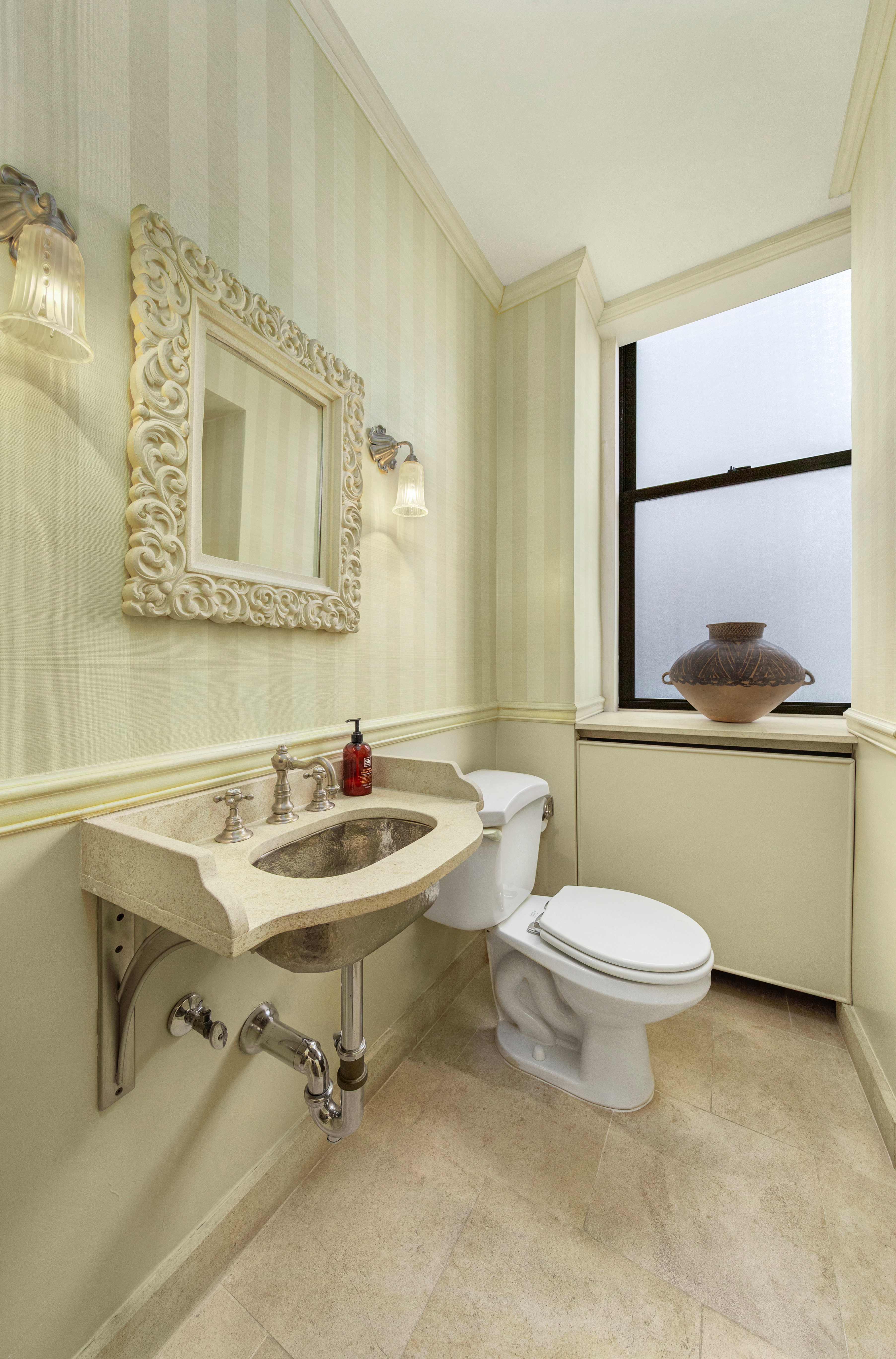 990 5th Avenue, Unit 4/5 Manhattan, NY 10075 - Photo 10 of 18 a bathroom with a sink mirror toilet and window