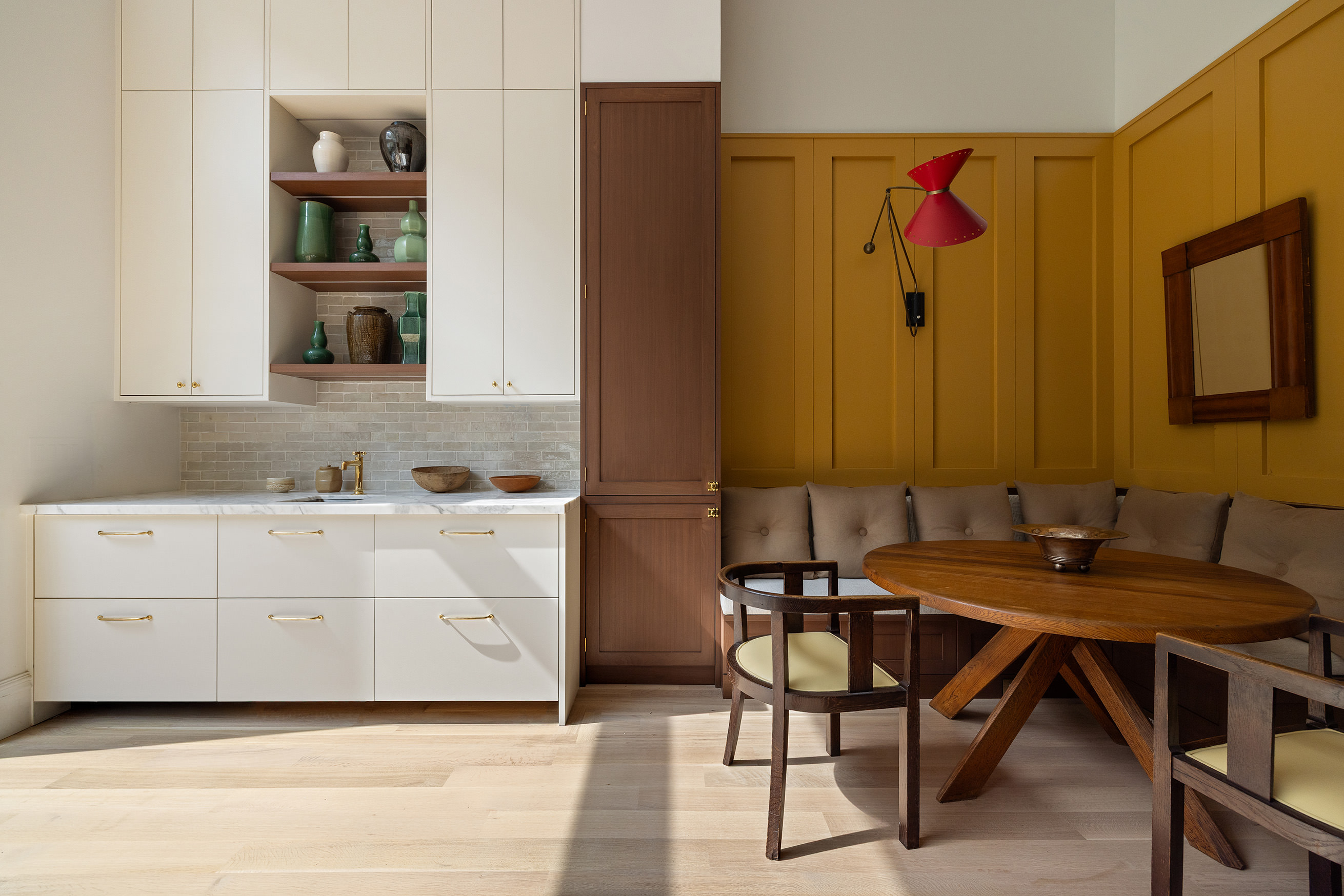 205 Clinton Street Brooklyn, NY 11201 - Photo 14 of 39 a kitchen with a table chairs and a refrigerator