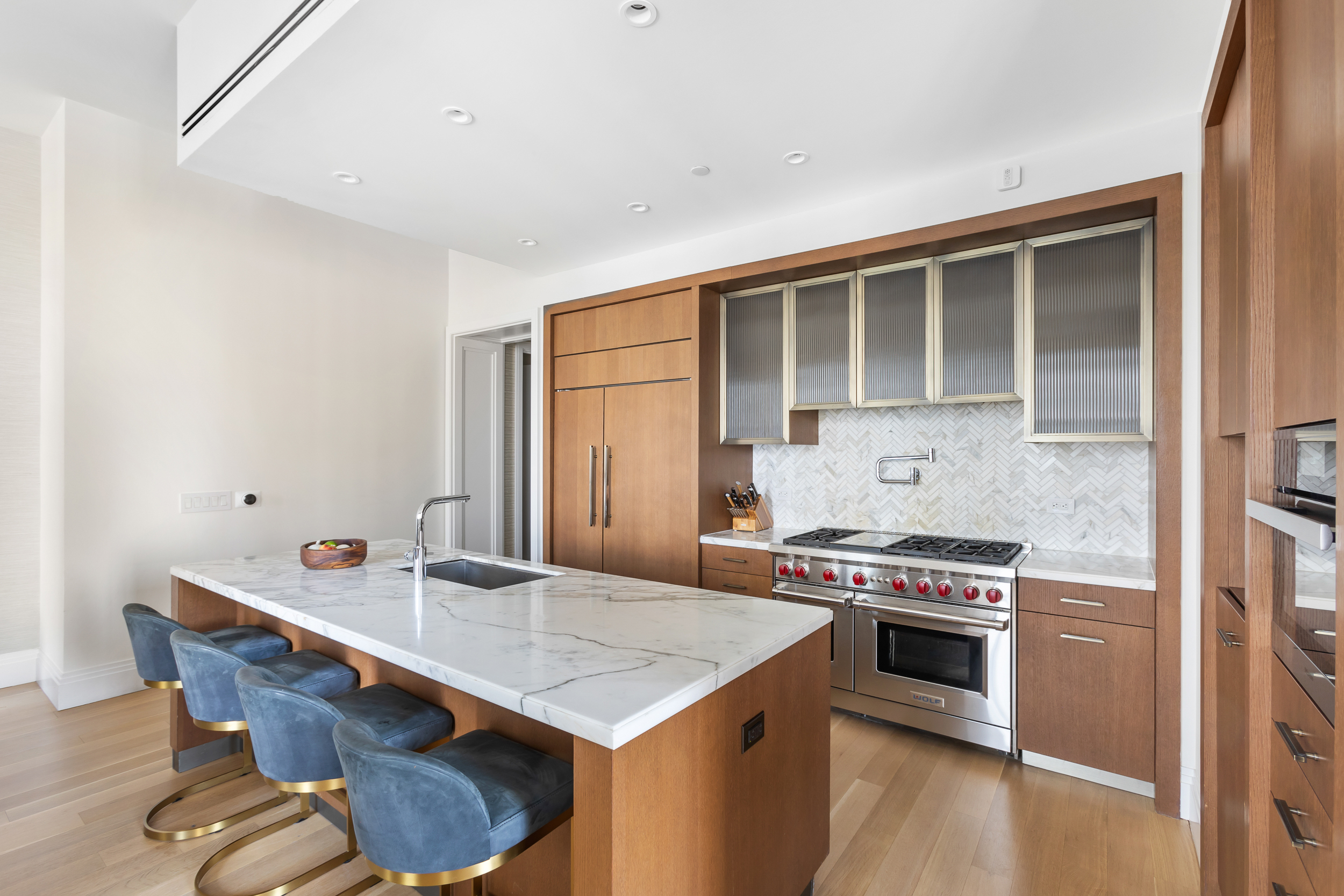 100 Barclay Street, Unit 17A Manhattan, NY 10007 - Photo 3 of 24 a kitchen with a stove a sink and a refrigerator