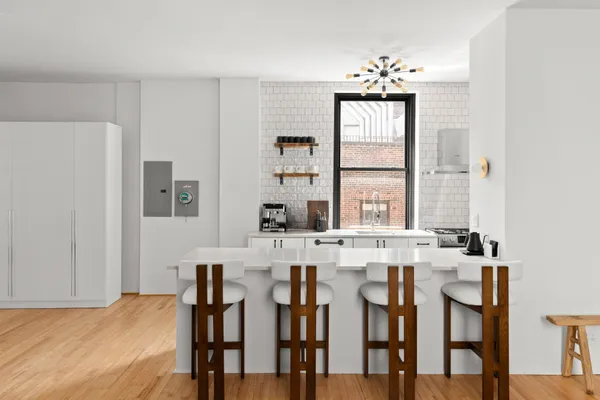 a view of a dining room with furniture and window