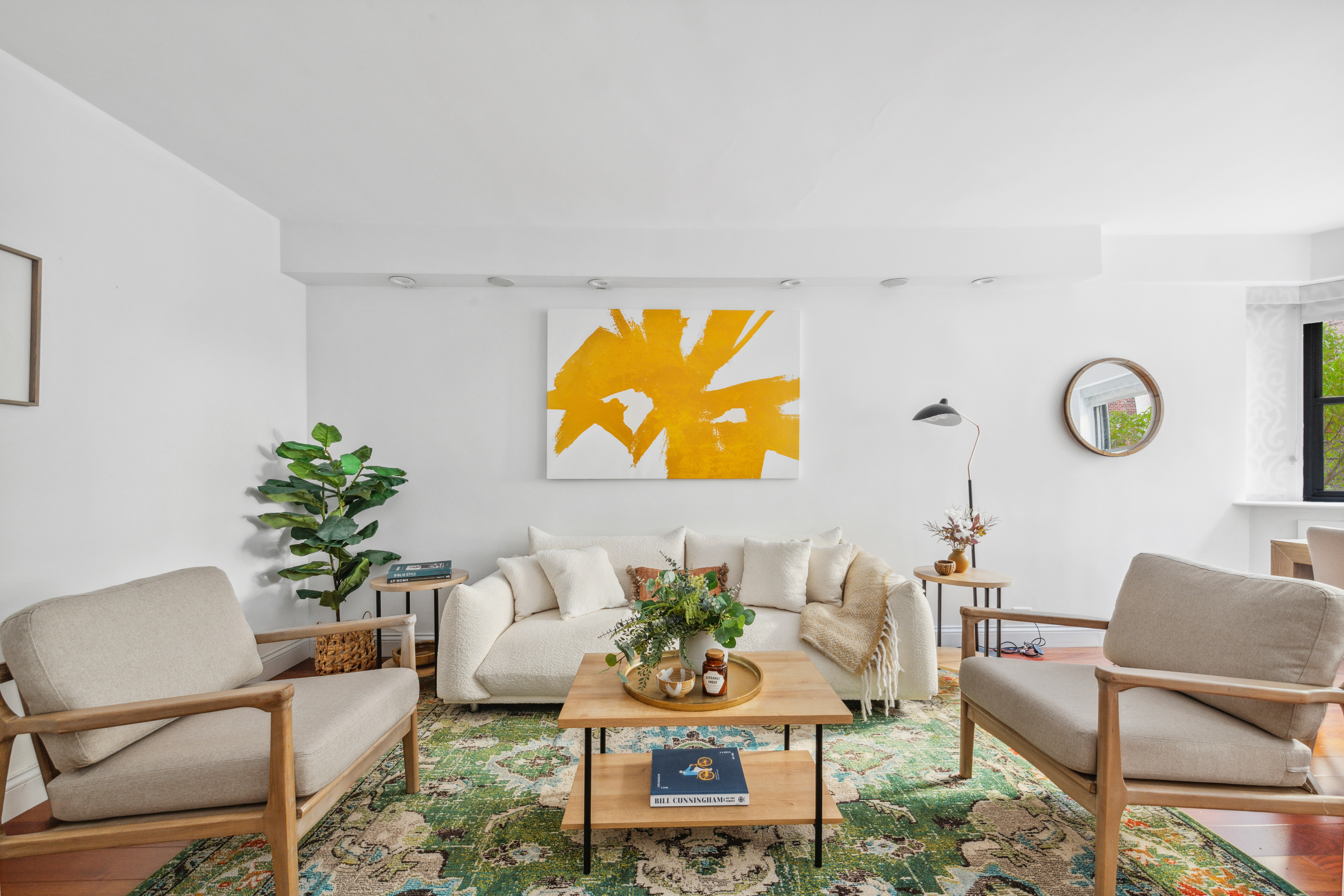 176 East 77th Street, Unit 2K Manhattan, NY 10075 - Photo 3 of 17 a living room with furniture cabinets and a potted plant