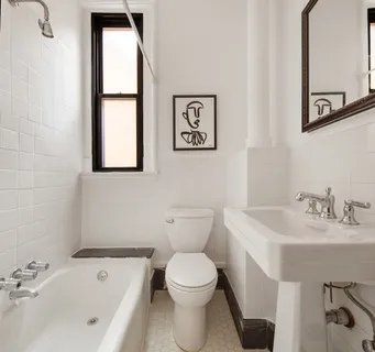 a bathroom with a toilet a sink and a bathtub