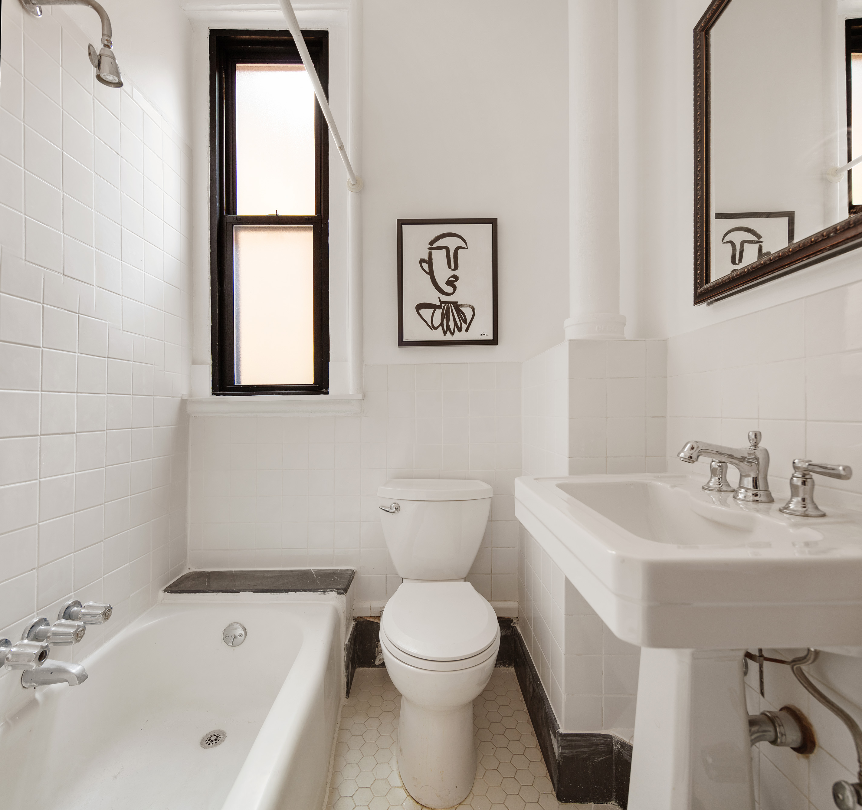 223 West 21st Street, Unit PH5M Manhattan, NY 10011 - Photo 8 of 12 a bathroom with a toilet a sink and a bathtub