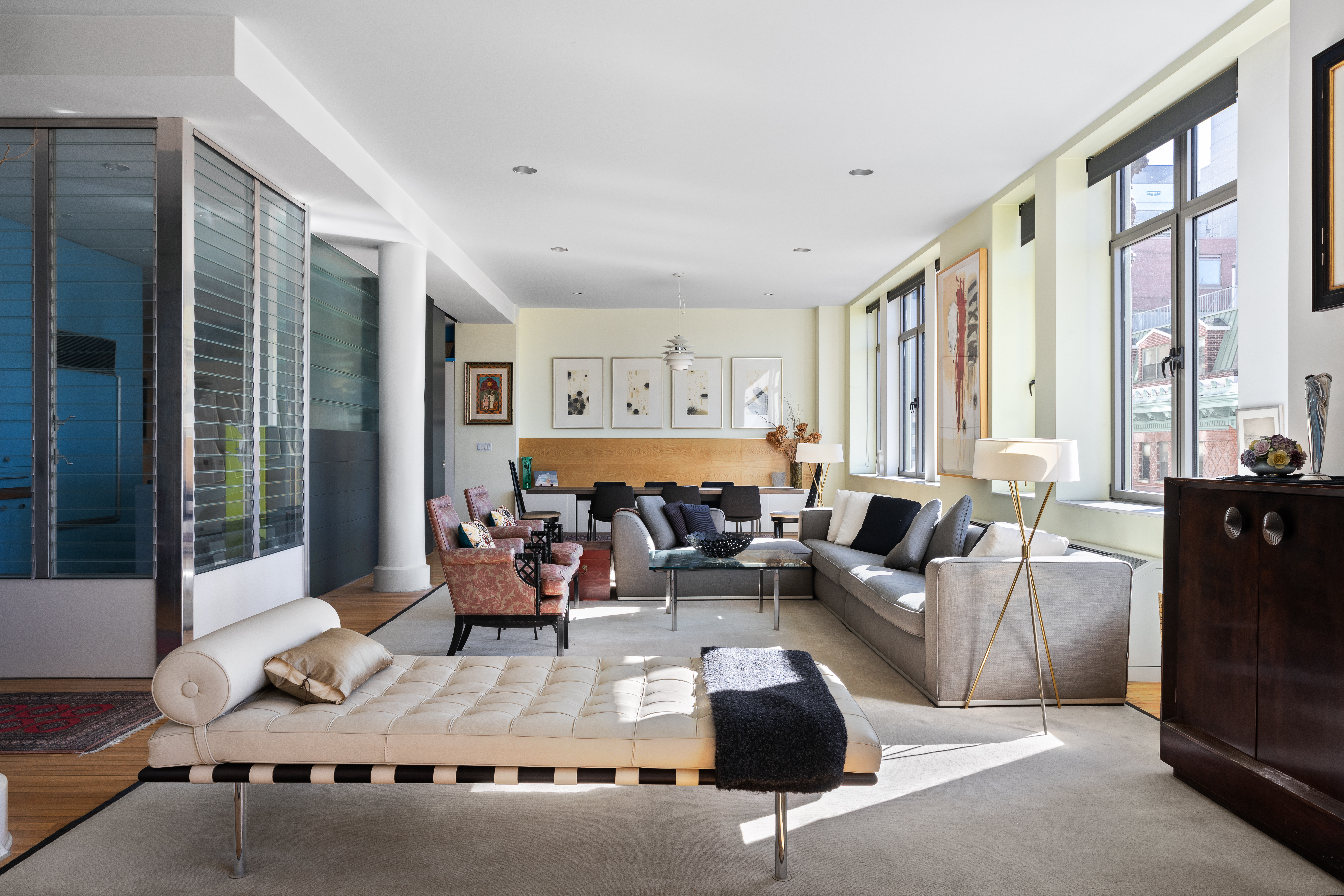 252 7th Avenue, Unit 9X Manhattan, NY 10001 - Photo 2 of 26 a living room with furniture and large windows