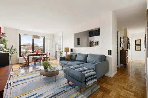 a living room with furniture and a table