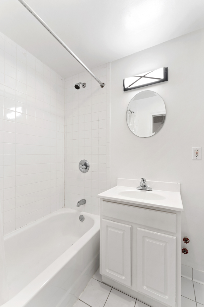 281 6th Street, Unit 1 Brooklyn, NY 11215 - Photo 7 of 7 a bathroom with a sink a toilet and shower