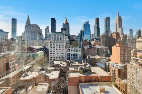 a view of city with tall buildings