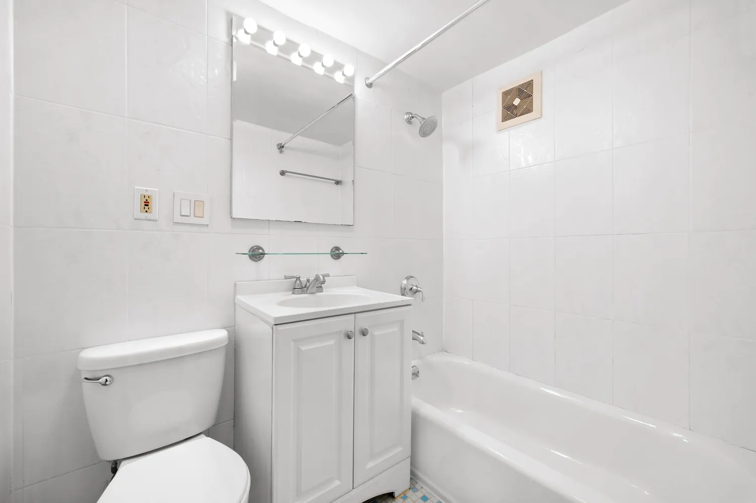 a bathroom with a sink toilet and vanity