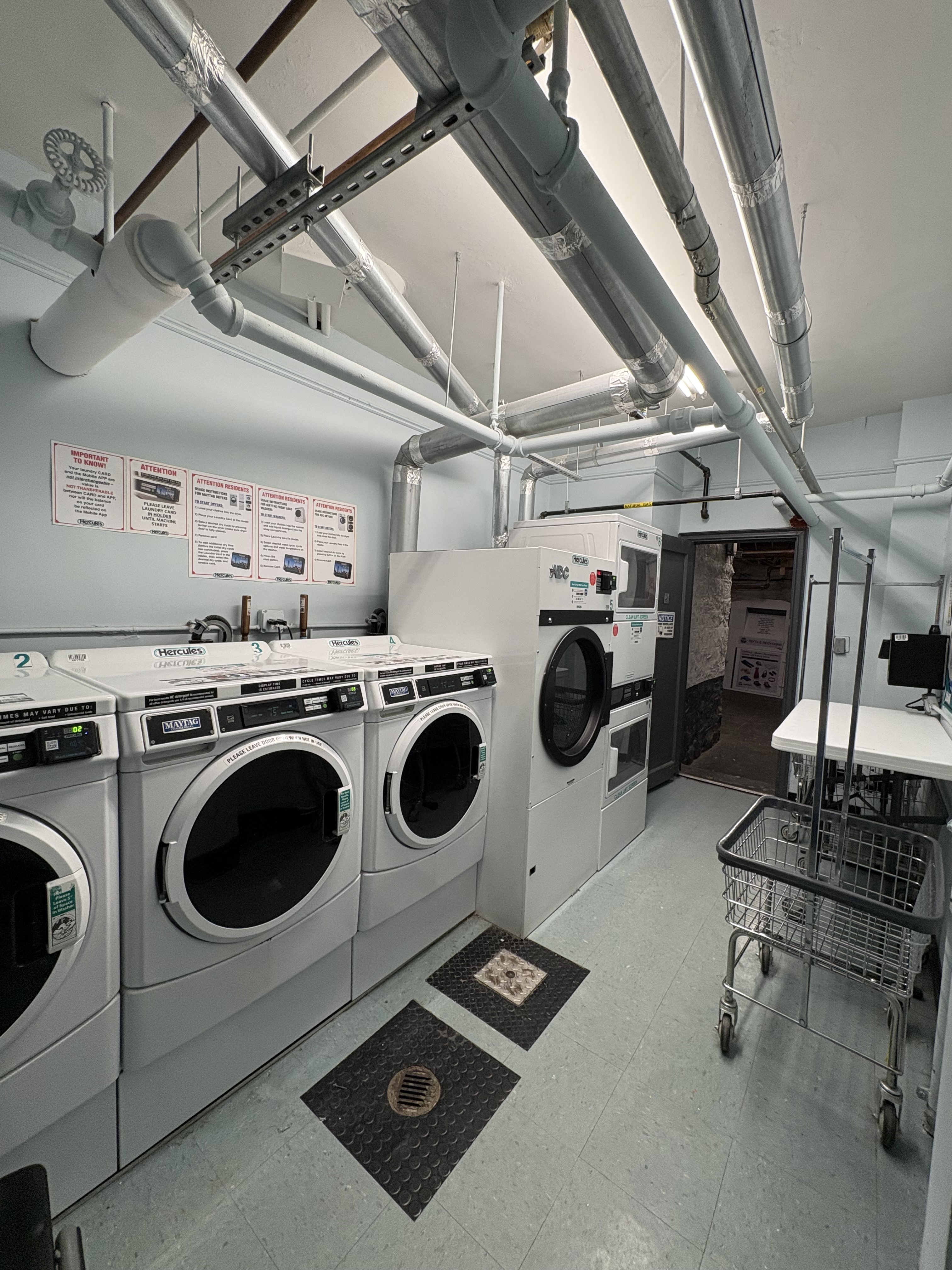 680 West 204th Street, Unit 4F Manhattan, NY 10034 - Photo 18 of 21 a utility room with dryer washer and other items