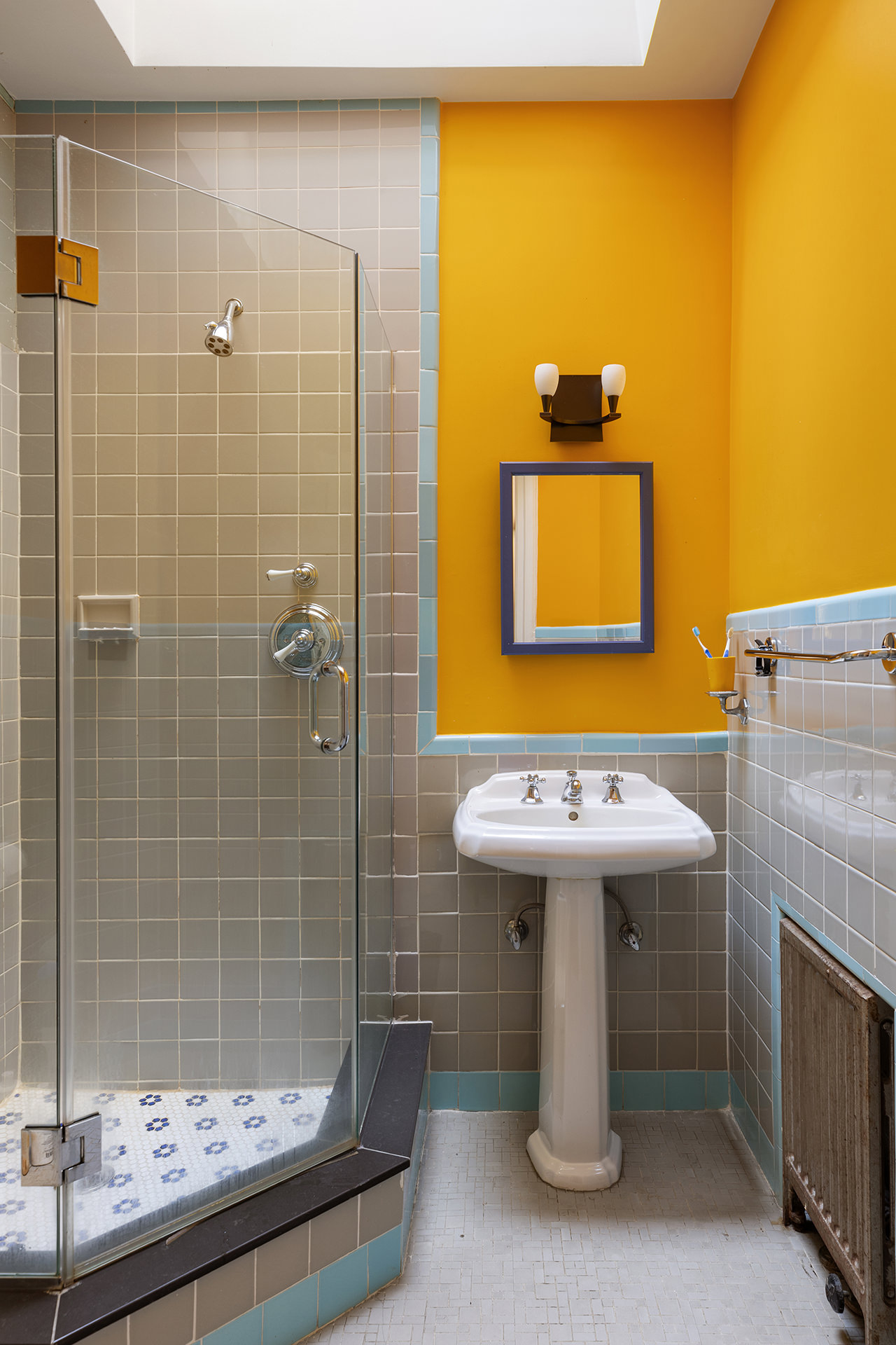 323 Garfield Place Brooklyn, NY 11215 - Photo 12 of 14 a bathroom with a sink and mirror