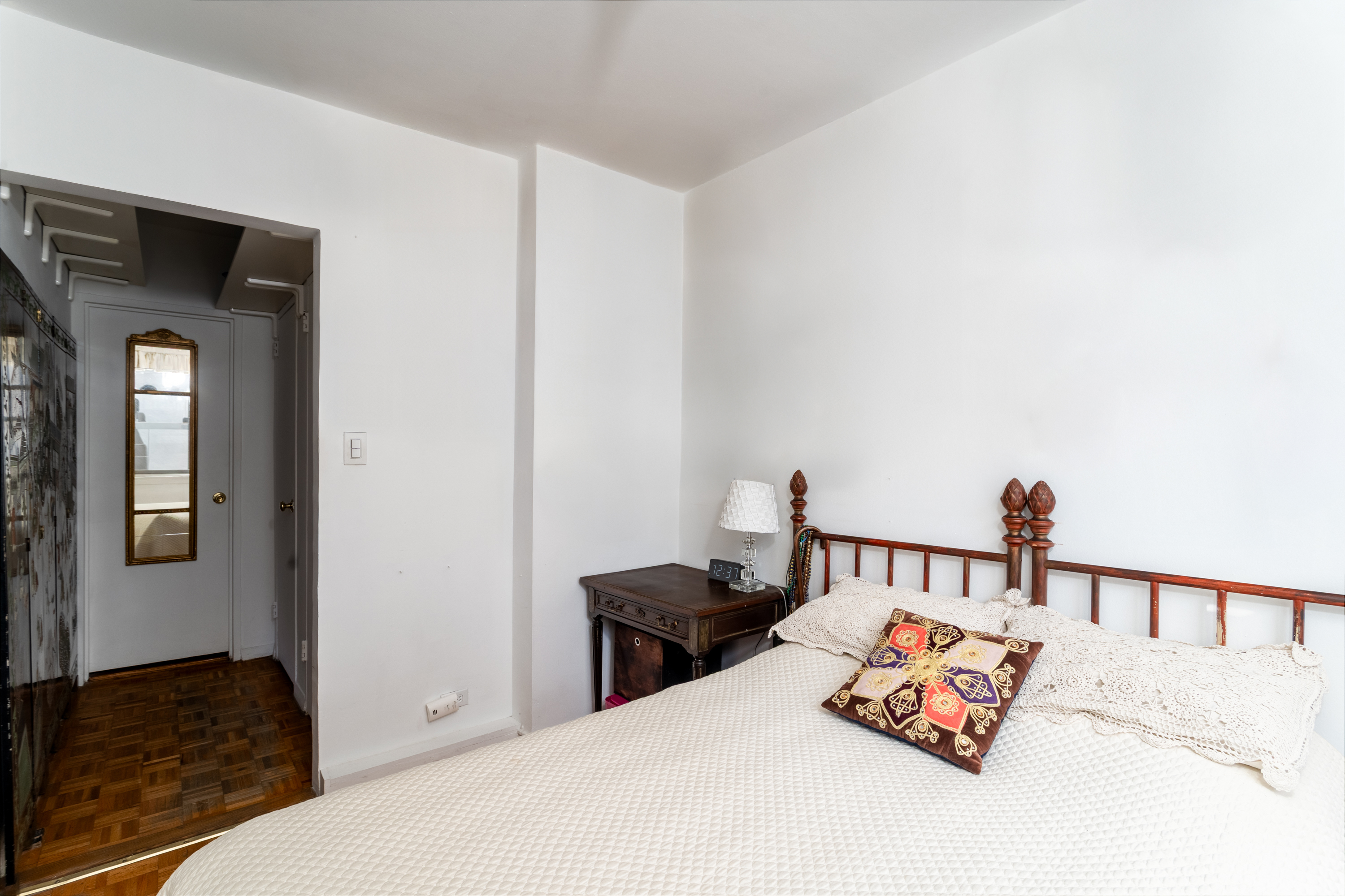 357 East 57th Street, Unit 5C Manhattan, NY 10022 - Photo 7 of 13 a bedroom with bed and a window