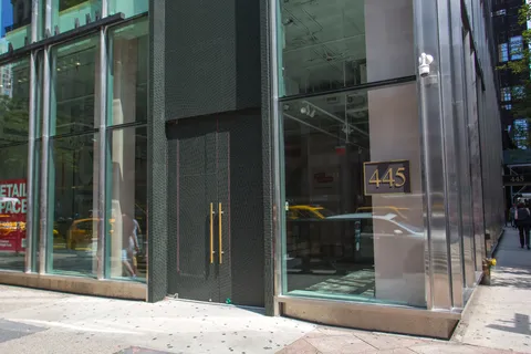 a picture of a bench in front of a window