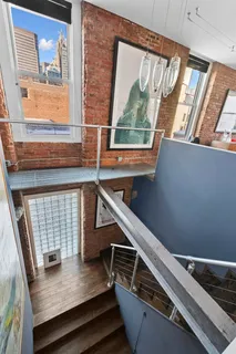 a view of a living room with furniture and a window