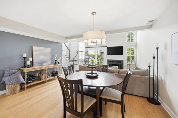 a view of a dining room with furniture window and wooden floor