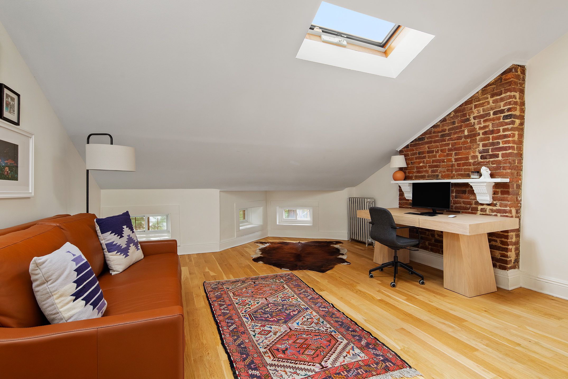 366 6th Avenue Brooklyn, NY 11215 - Photo 15 of 20 a living room with furniture and a wooden floor