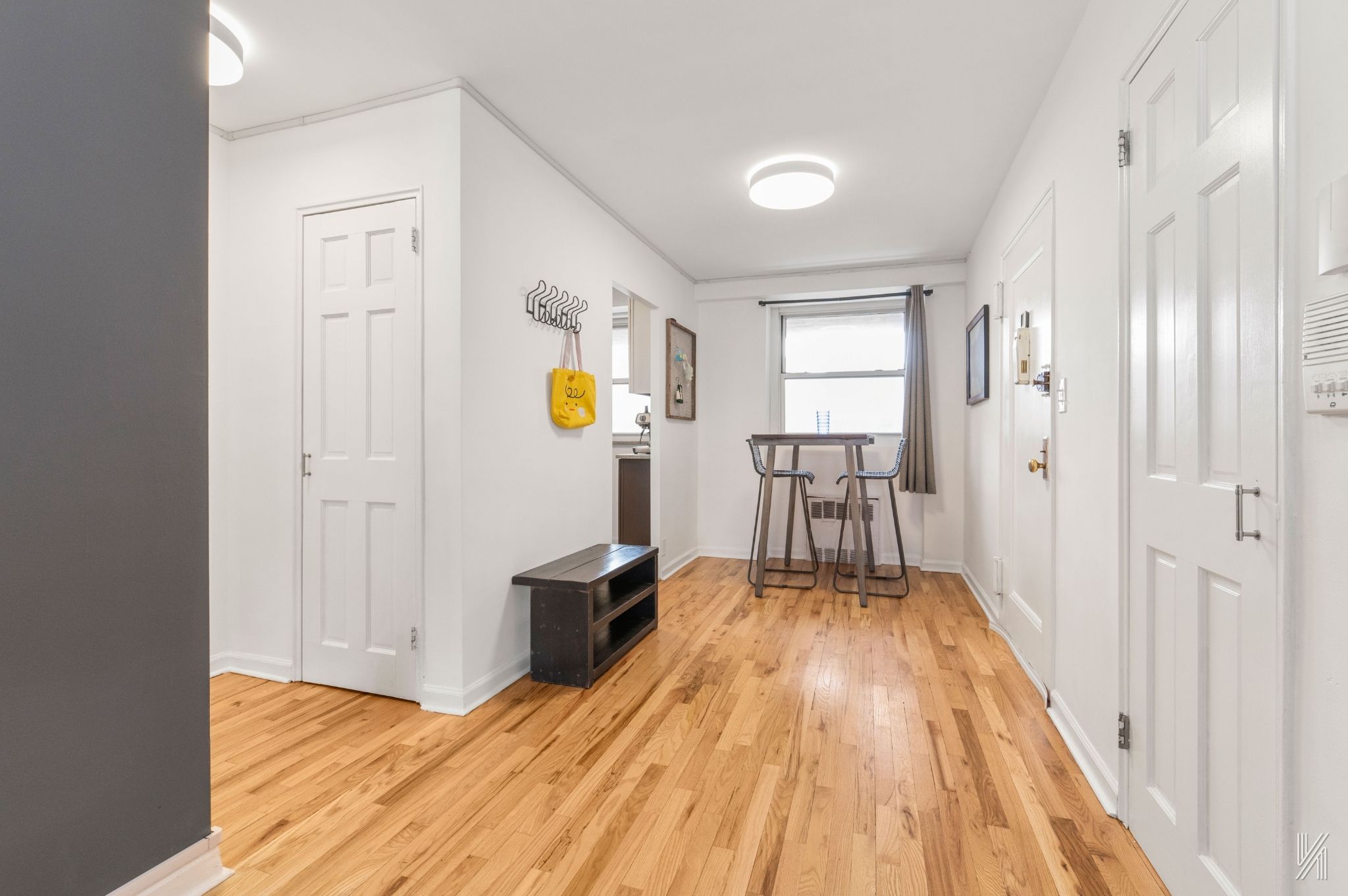 35-50 85th Street, Unit 7H Queens, NY 11372 - Photo 8 of 16 a view of a livingroom with wooden floor and furniture