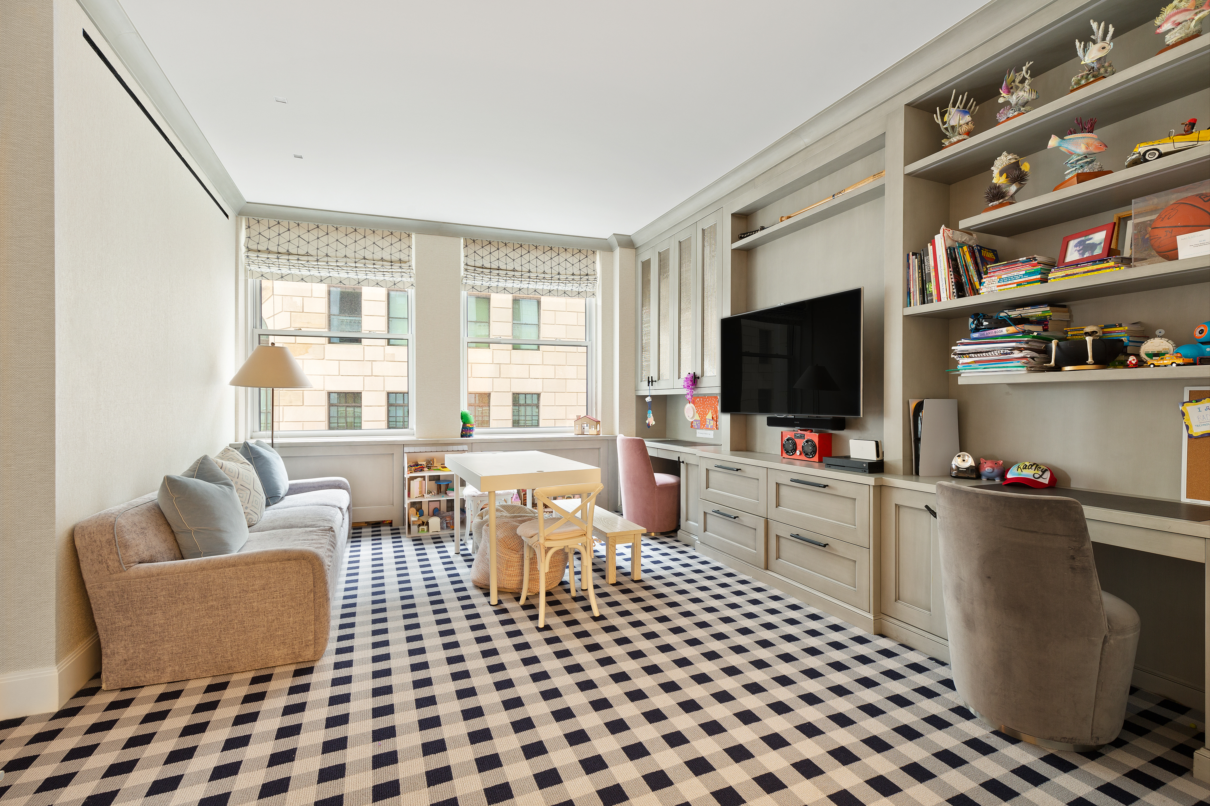 55 Liberty Street, Unit 15 Manhattan, NY 10005 - Photo 18 of 25 a living room with furniture and a flat screen tv