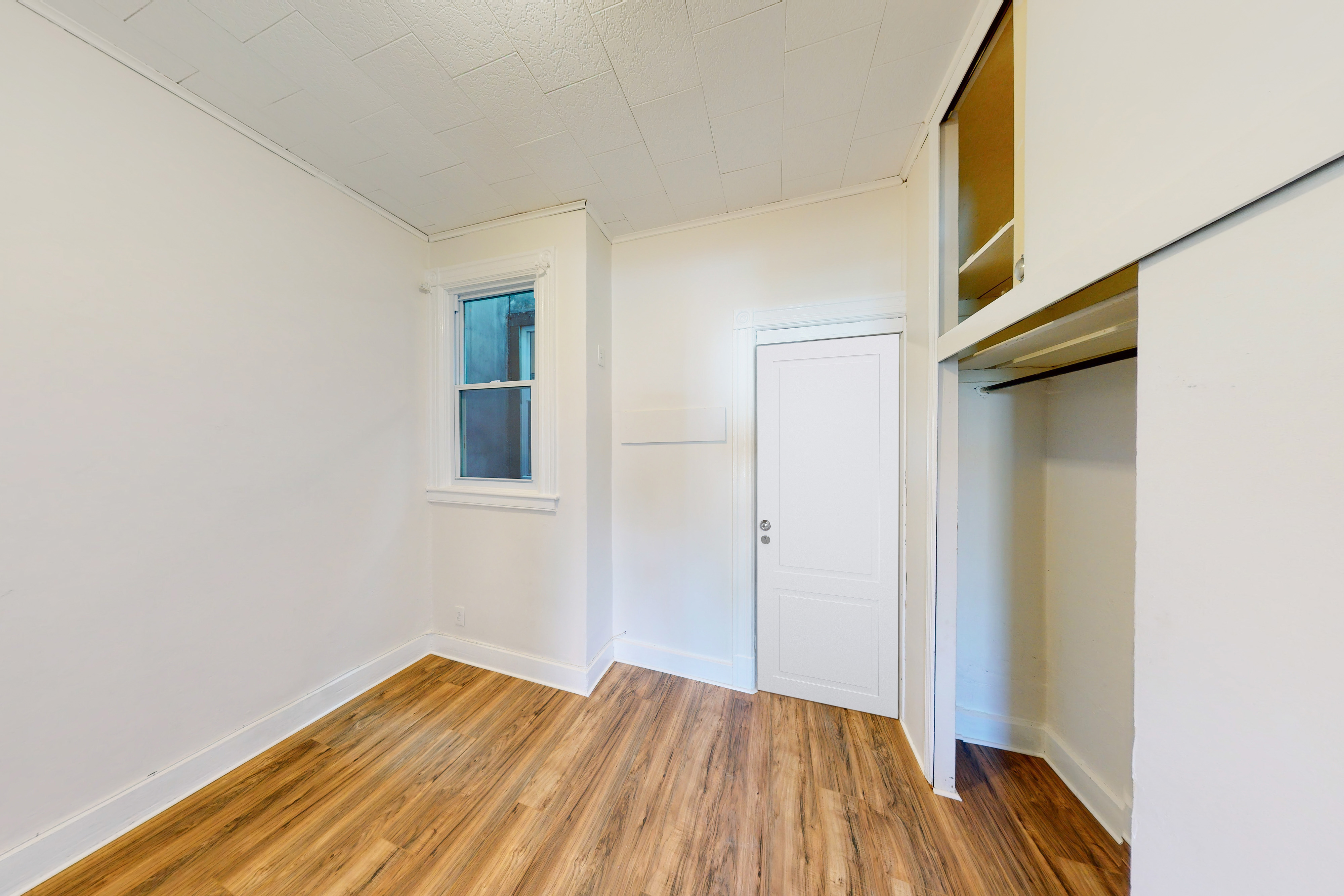 239 Withers Street, Unit 2 Brooklyn, NY 11211 - Photo 3 of 6 a view of empty room with wooden floor and fan
