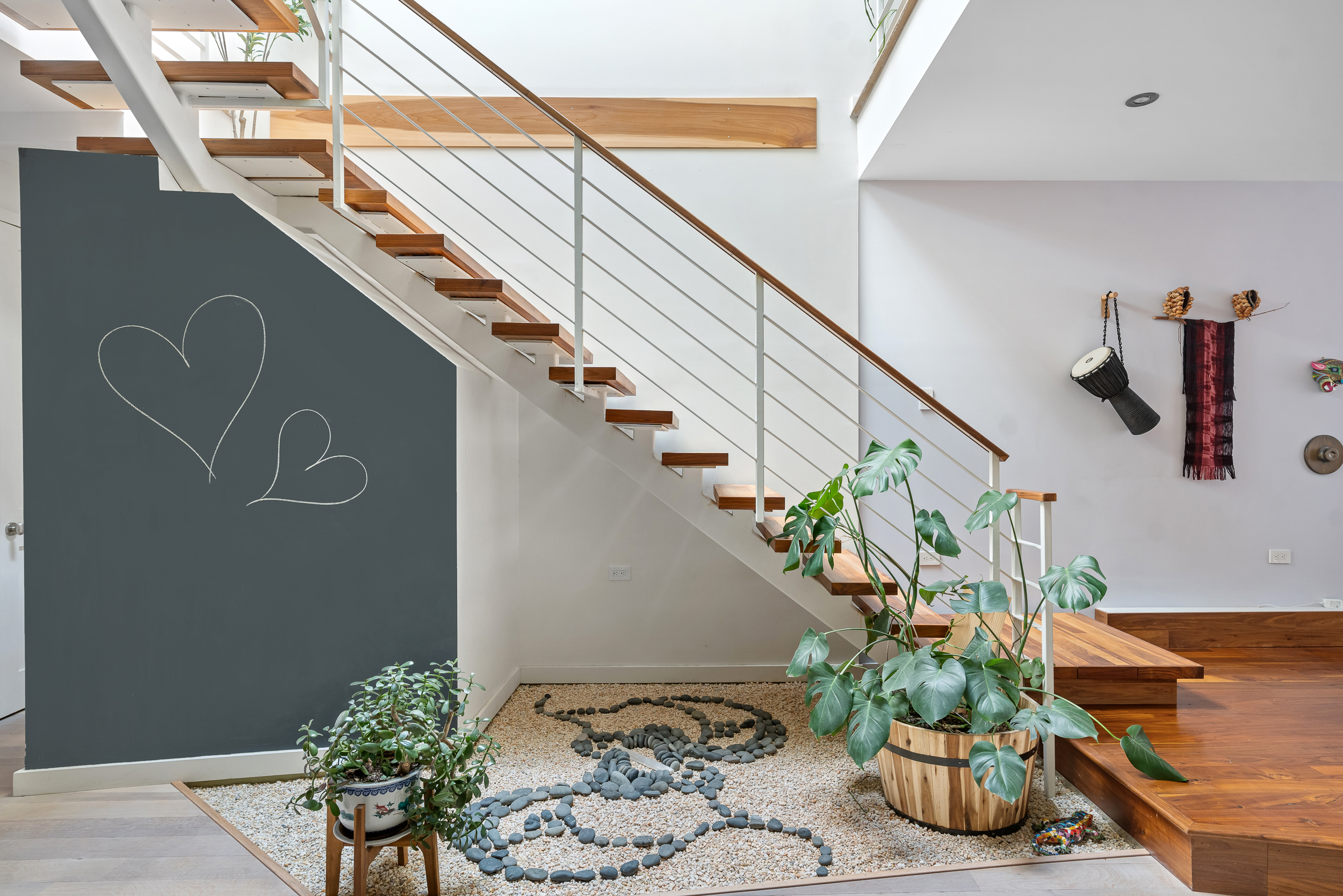 65 Jackson Street Brooklyn, NY 11211 - Photo 8 of 36 a vase of flowers sitting on a floor in front of a door