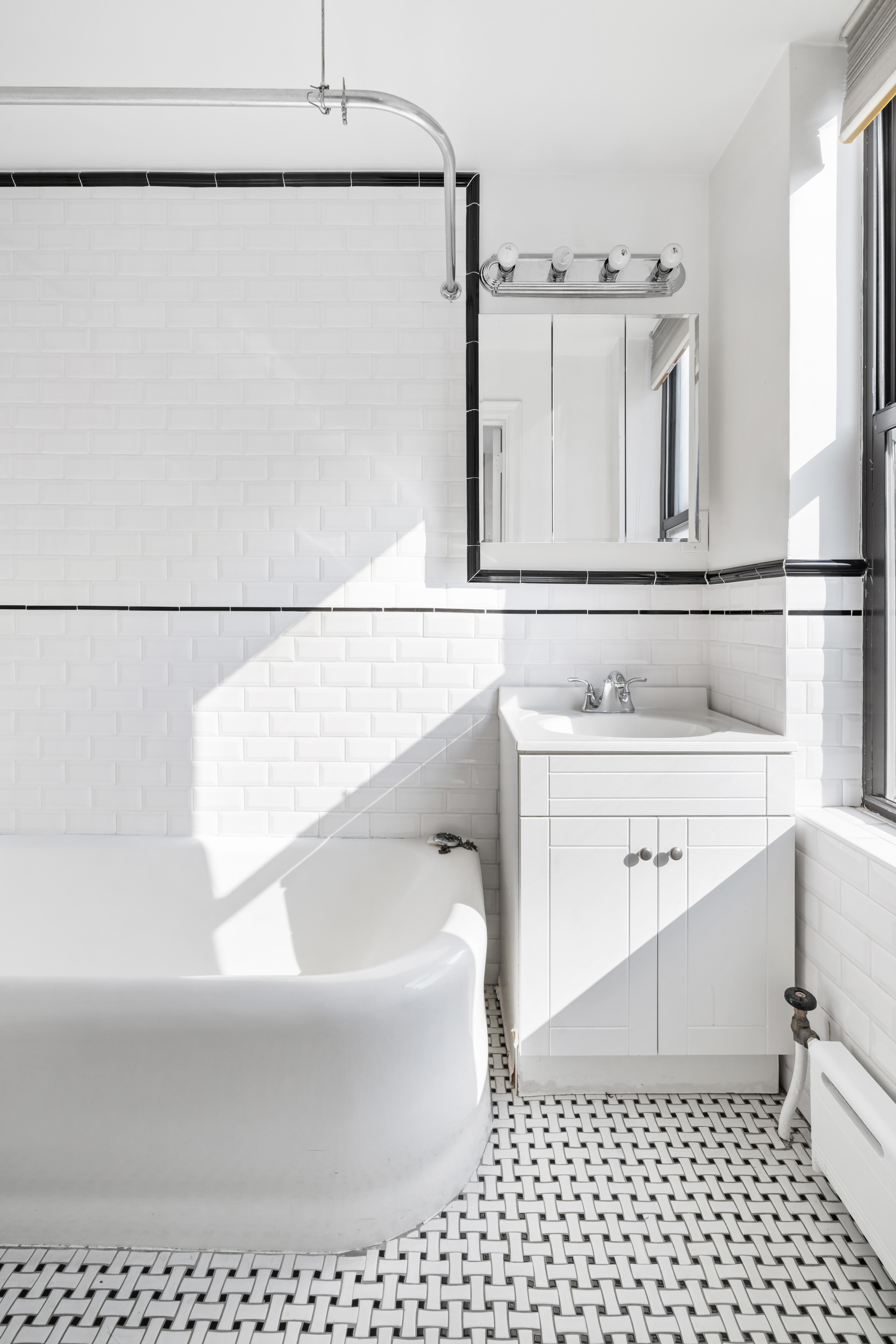 444 Central Park West, Unit 5E Manhattan, NY 10025 - Photo 9 of 14 a bathroom with a bathtub and shower