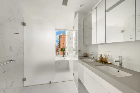 a kitchen with stainless steel appliances granite countertop a sink a stove and cabinets