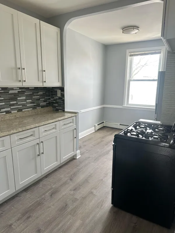 a kitchen with a cabinets and a stove