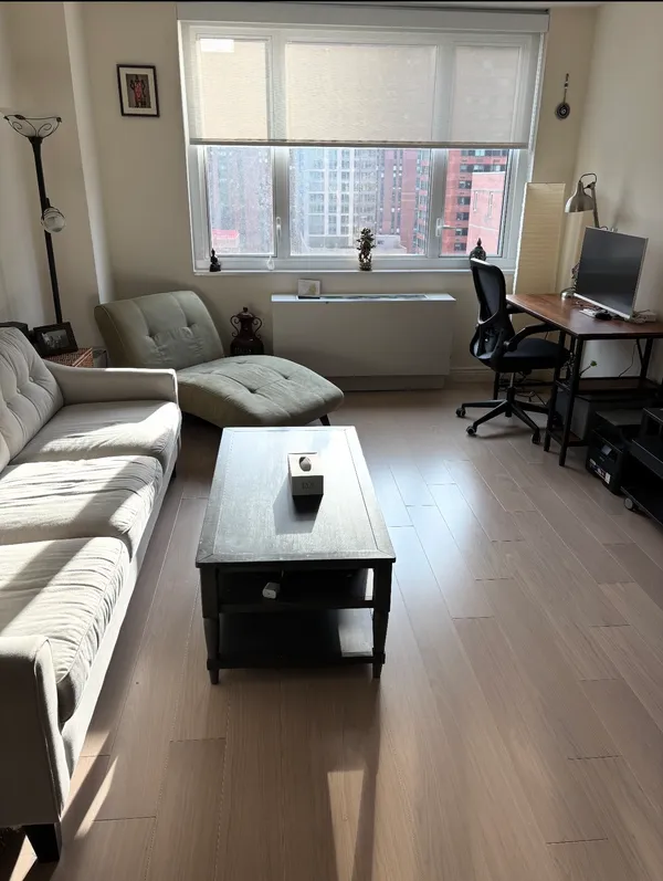 a living room with furniture and a window