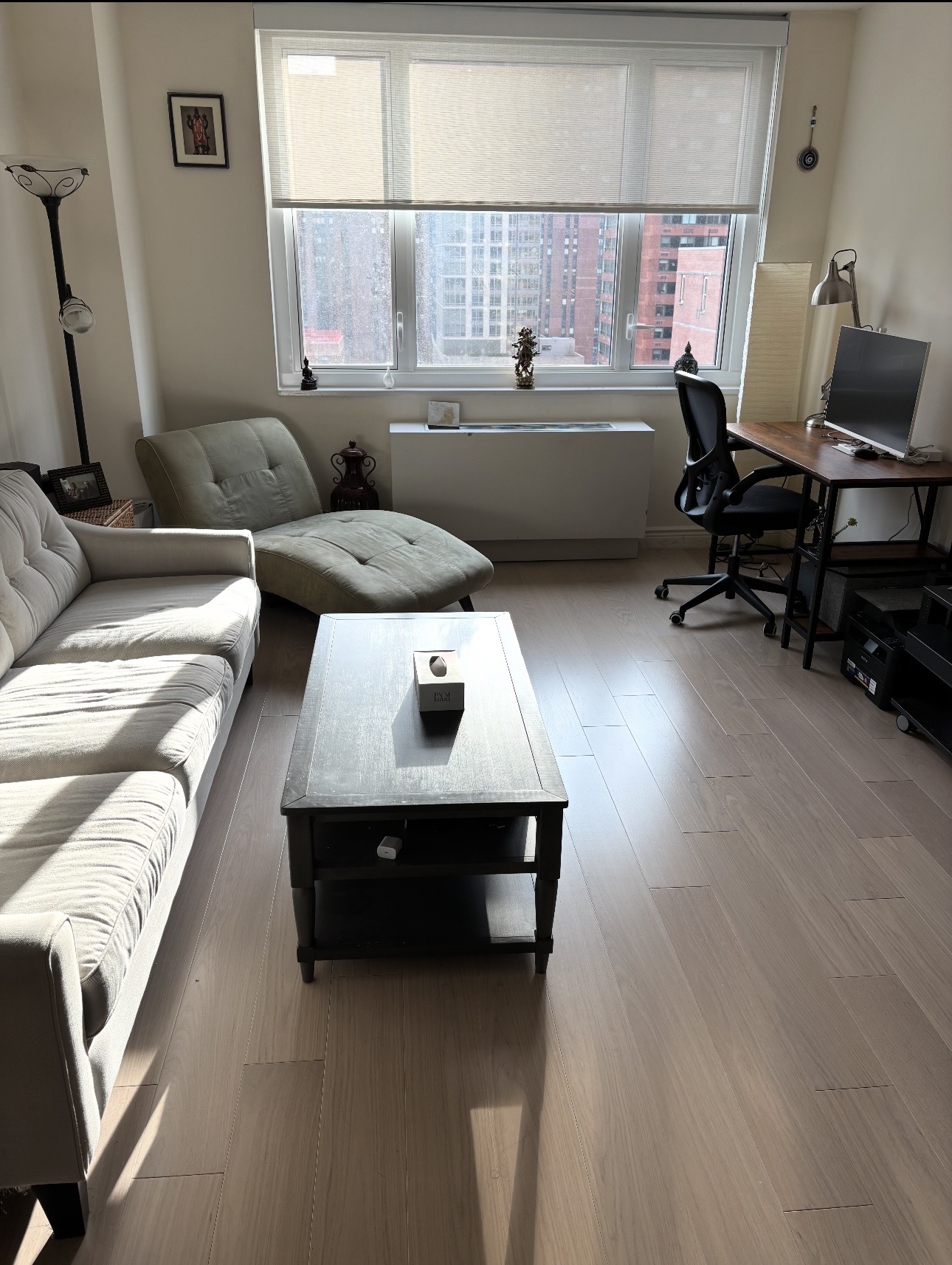 a living room with furniture and a window