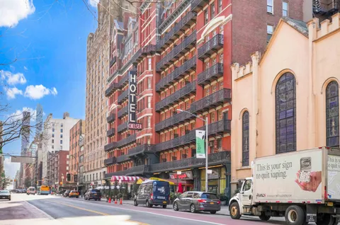 a city street lined with buildings and cars
