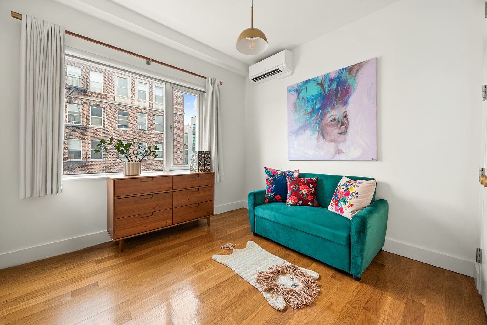 432 Grand Street, Unit 402 Brooklyn, NY 11211 - Photo 8 of 12 a living room with furniture and a window