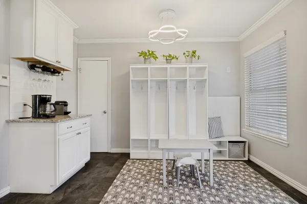 a view of a storage & utility room with a window