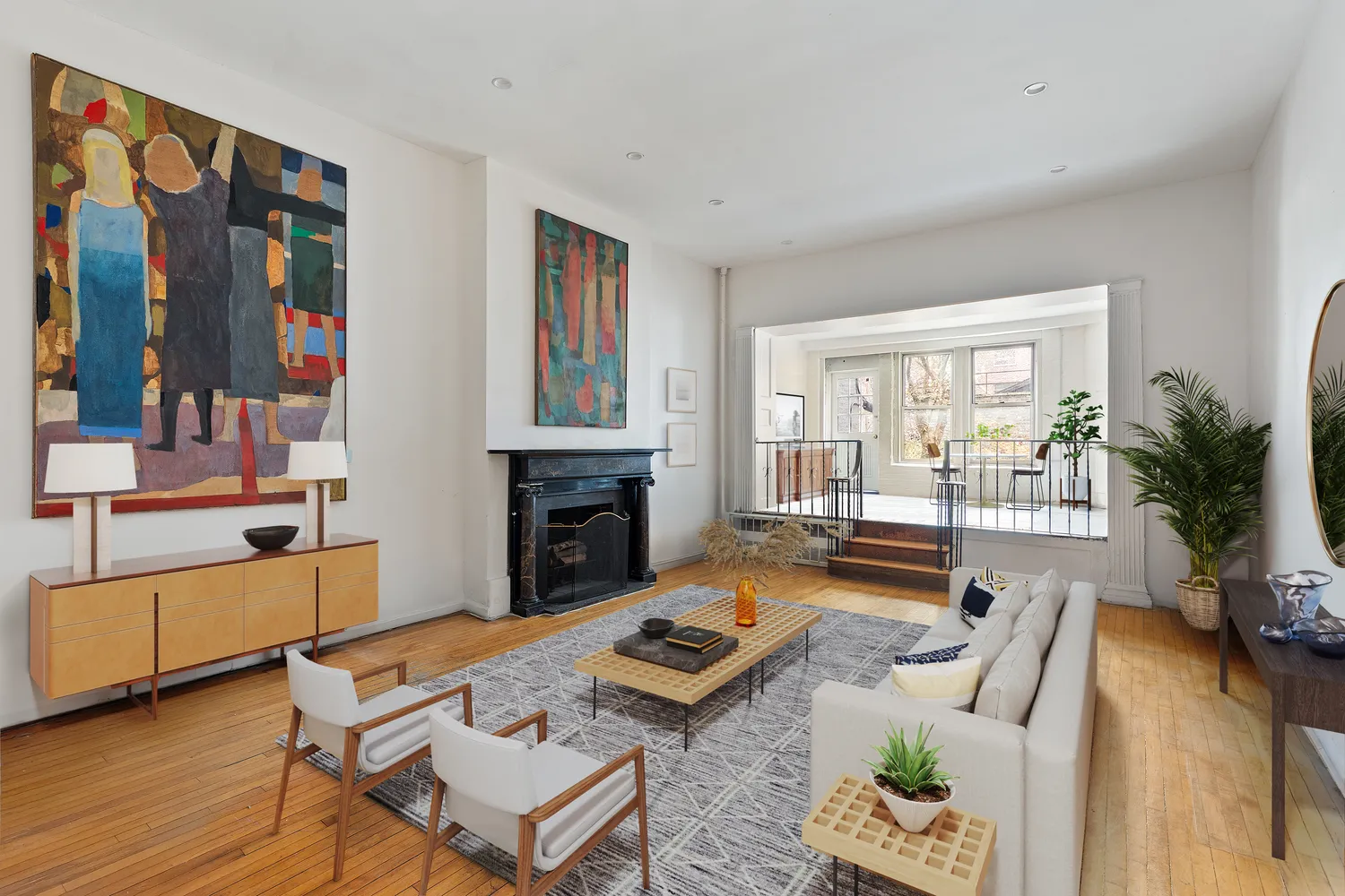 a living room with furniture fireplace and flat screen tv