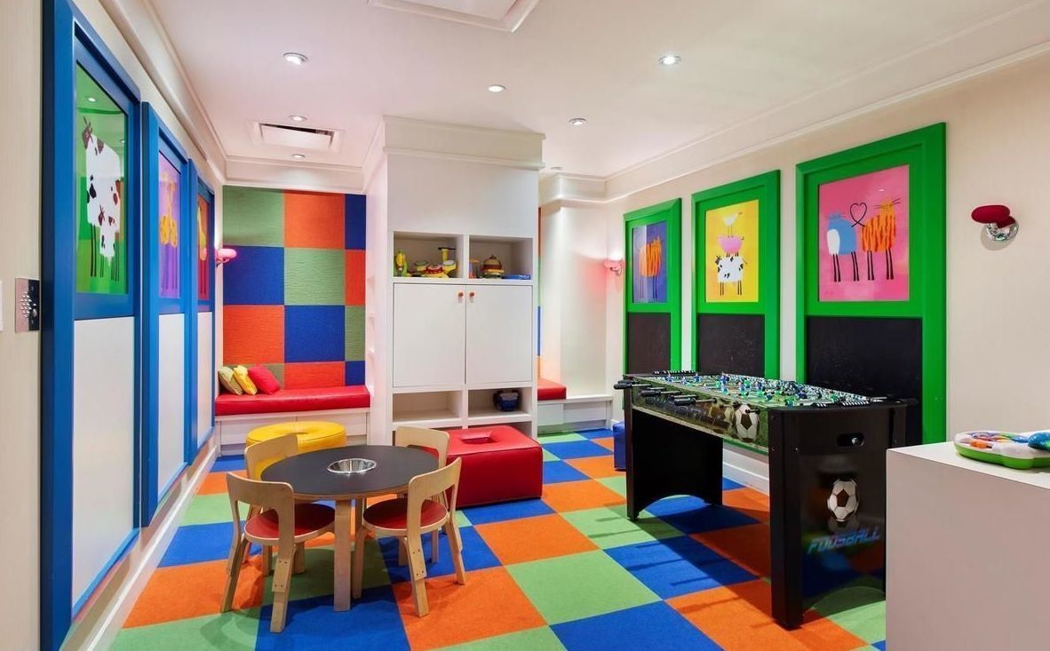 250 East 53rd Street, Unit 1001 Manhattan, NY 10022 - Photo 16 of 18 a room with musical instruments and air hockey table