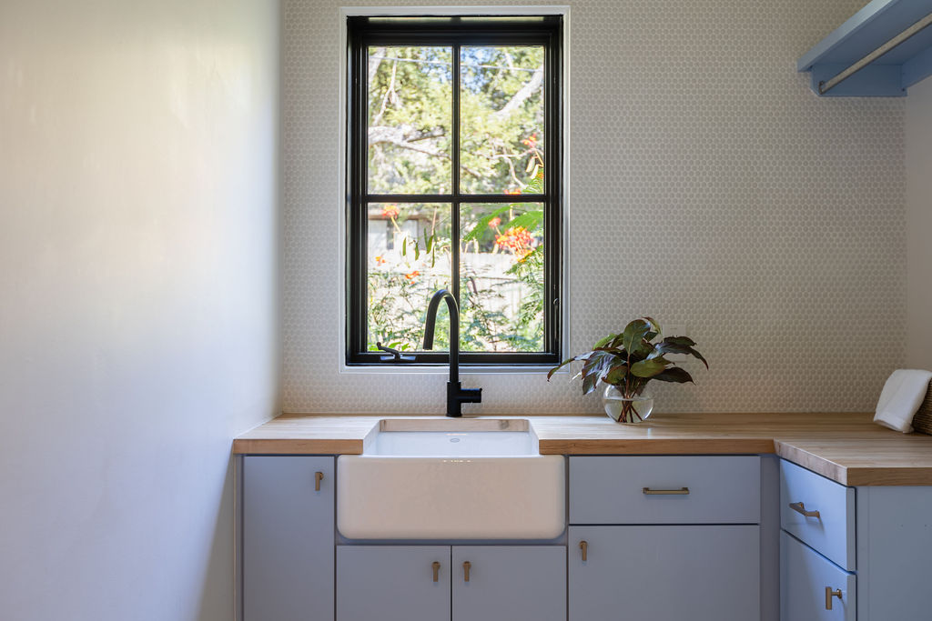 400 Inwood Road Austin, TX 78746 - Photo 16 of 43 a bathroom with a sink and a window