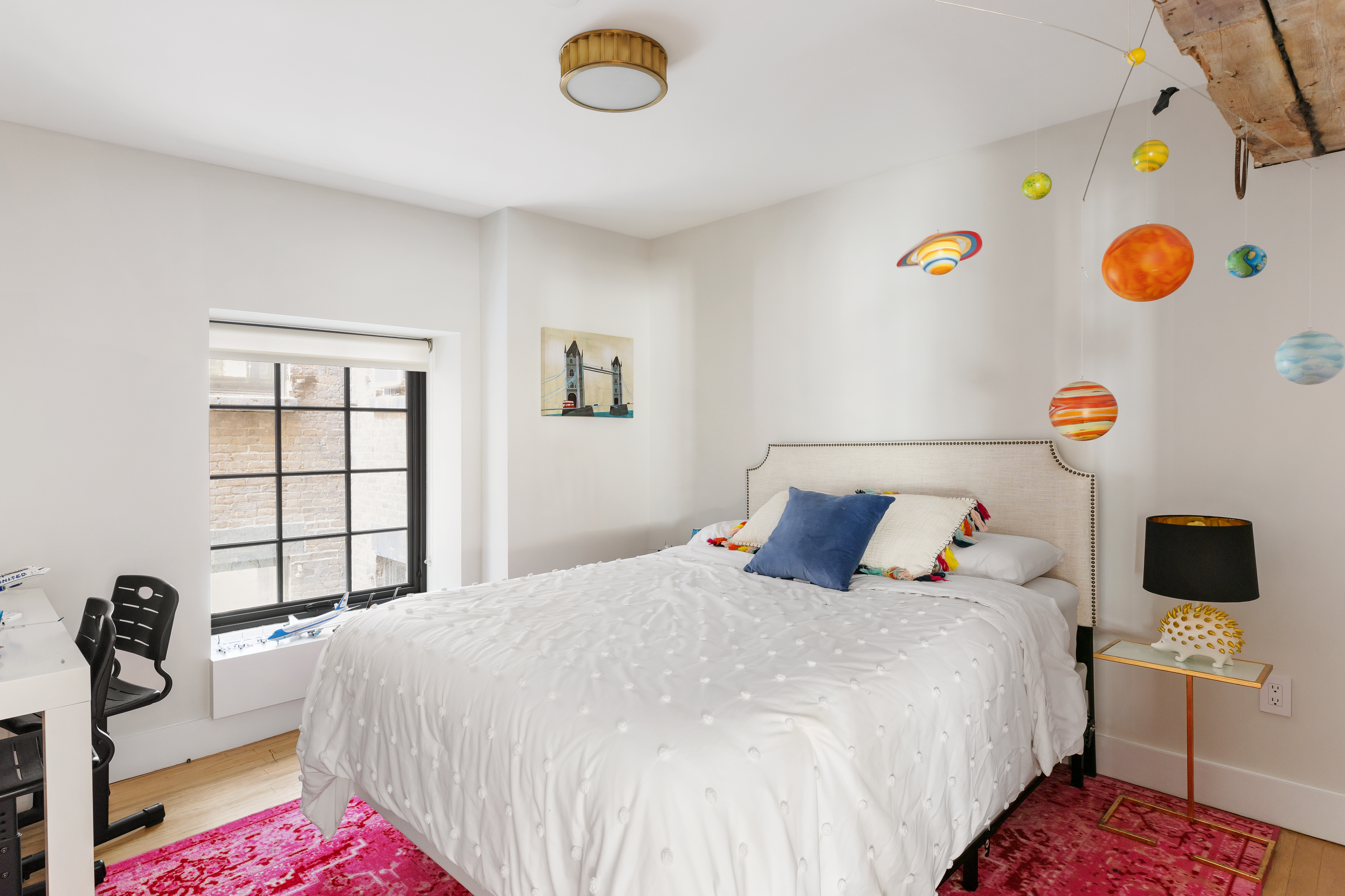 466 Washington Street, Unit 3W Manhattan, NY 10013 - Photo 11 of 14 a bedroom with a bed and a window