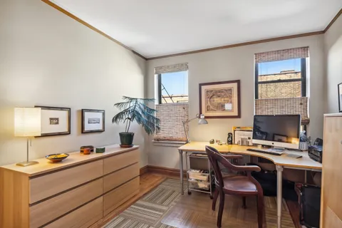 a workspace with furniture and window