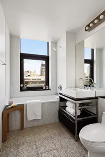 a swimming pool with outdoor seating and yard