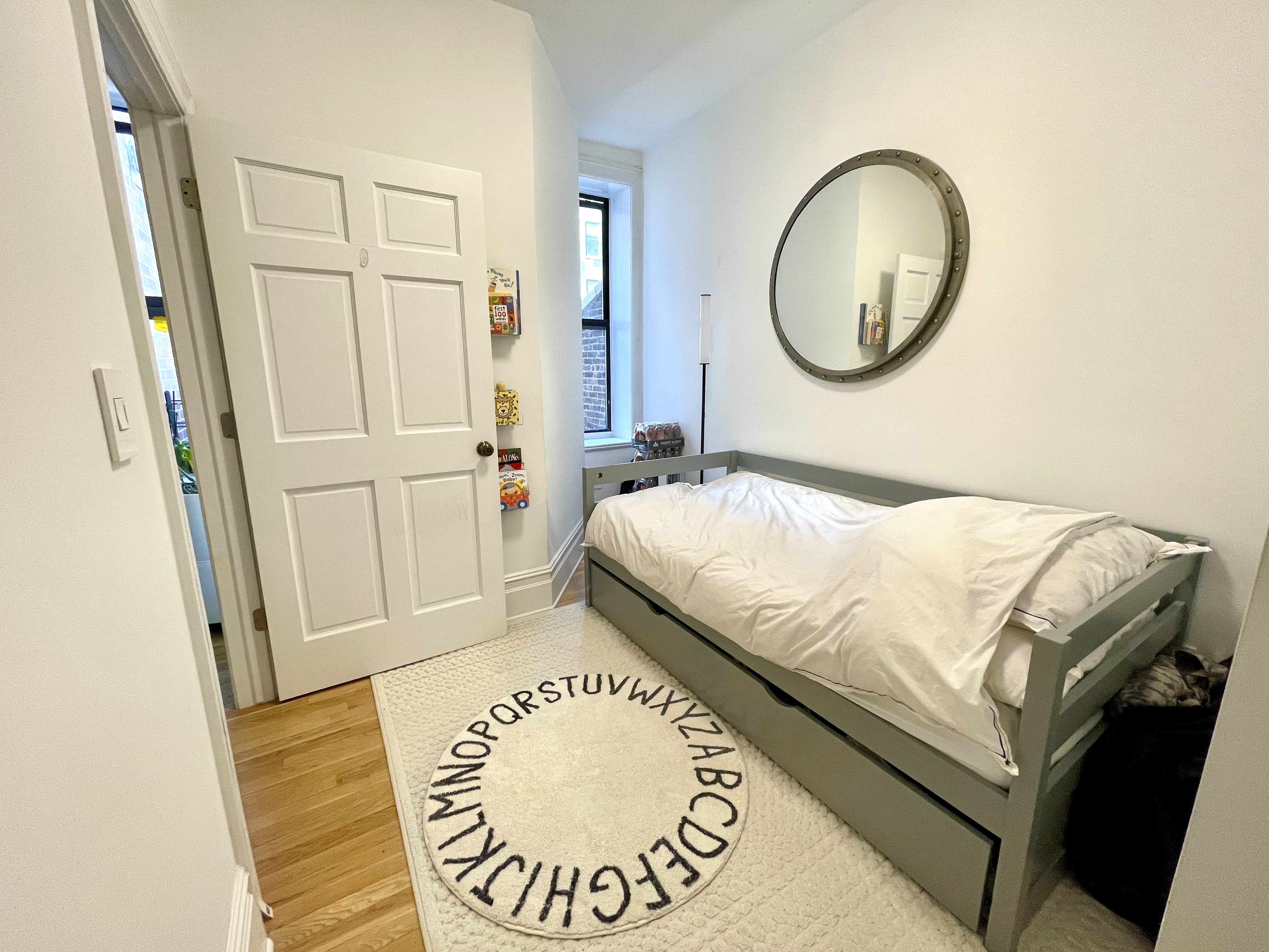 203 West 90th Street, Unit 6B Manhattan, NY 10024 - Photo 13 of 22 a bedroom with a bed and a mirror