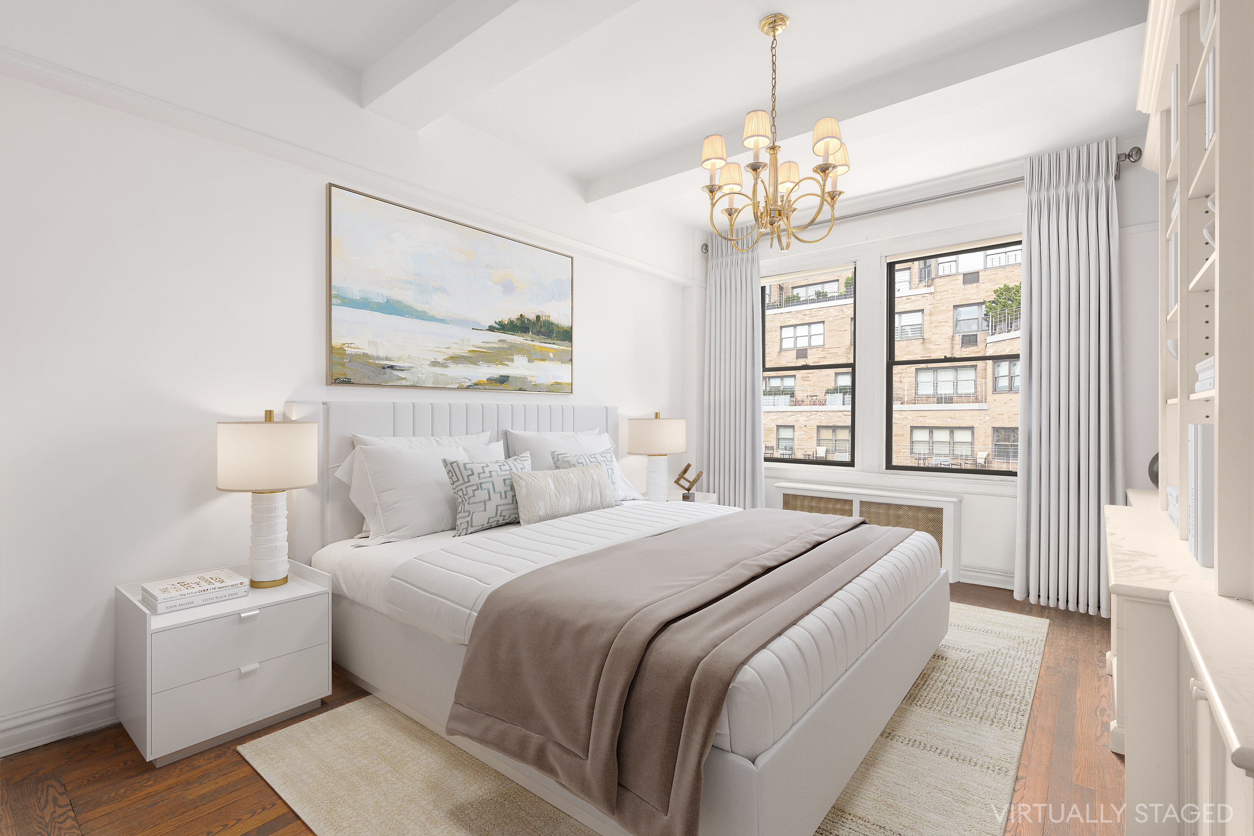 140 East 81st Street, Unit 12B Manhattan, NY 10028 - Photo 6 of 9 a bedroom with a large bed and a chandelier