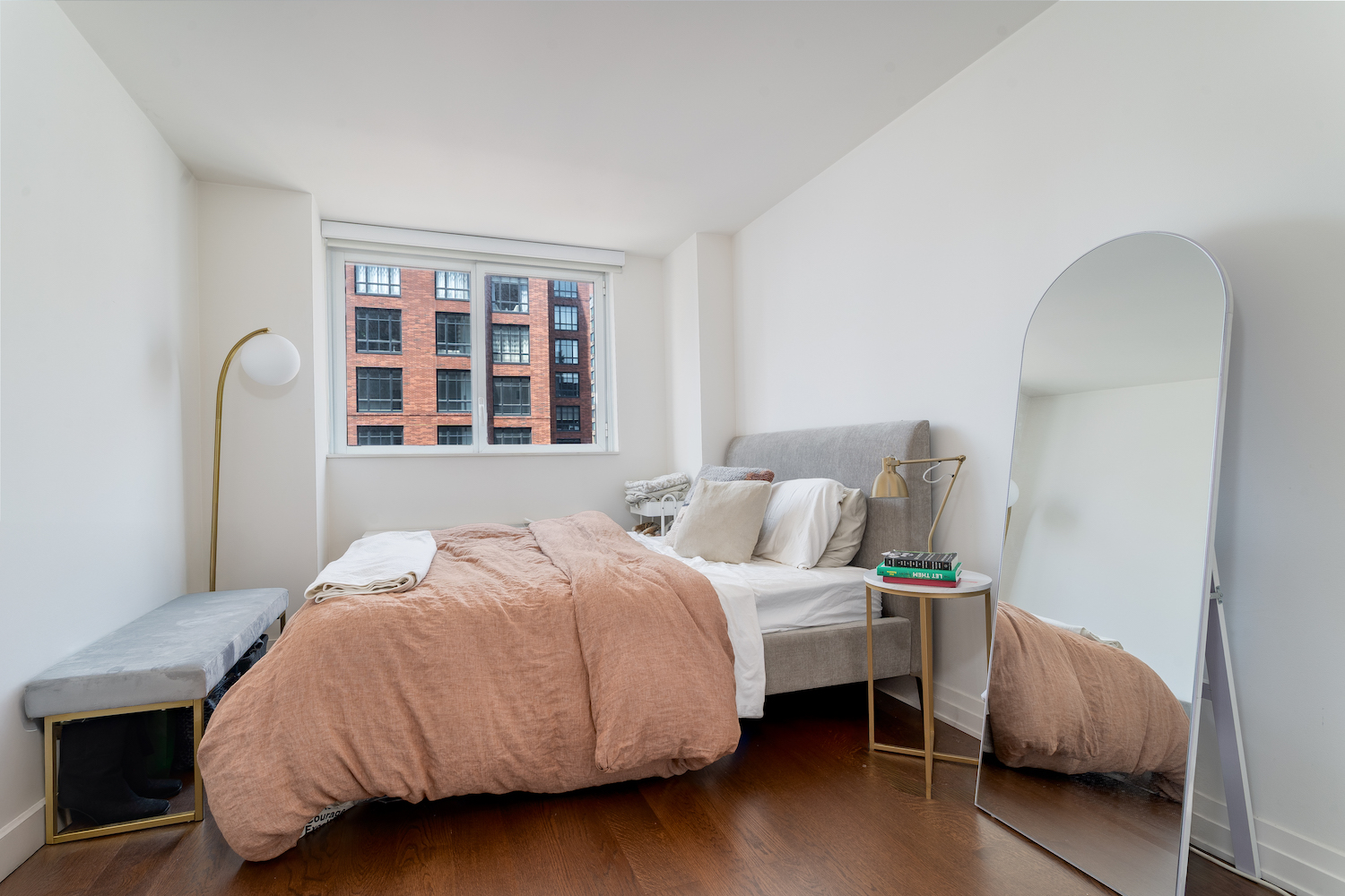 200 East 94th Street, Unit 2015 Manhattan, NY 10128 - Photo 6 of 16 a bedroom with bed and a window