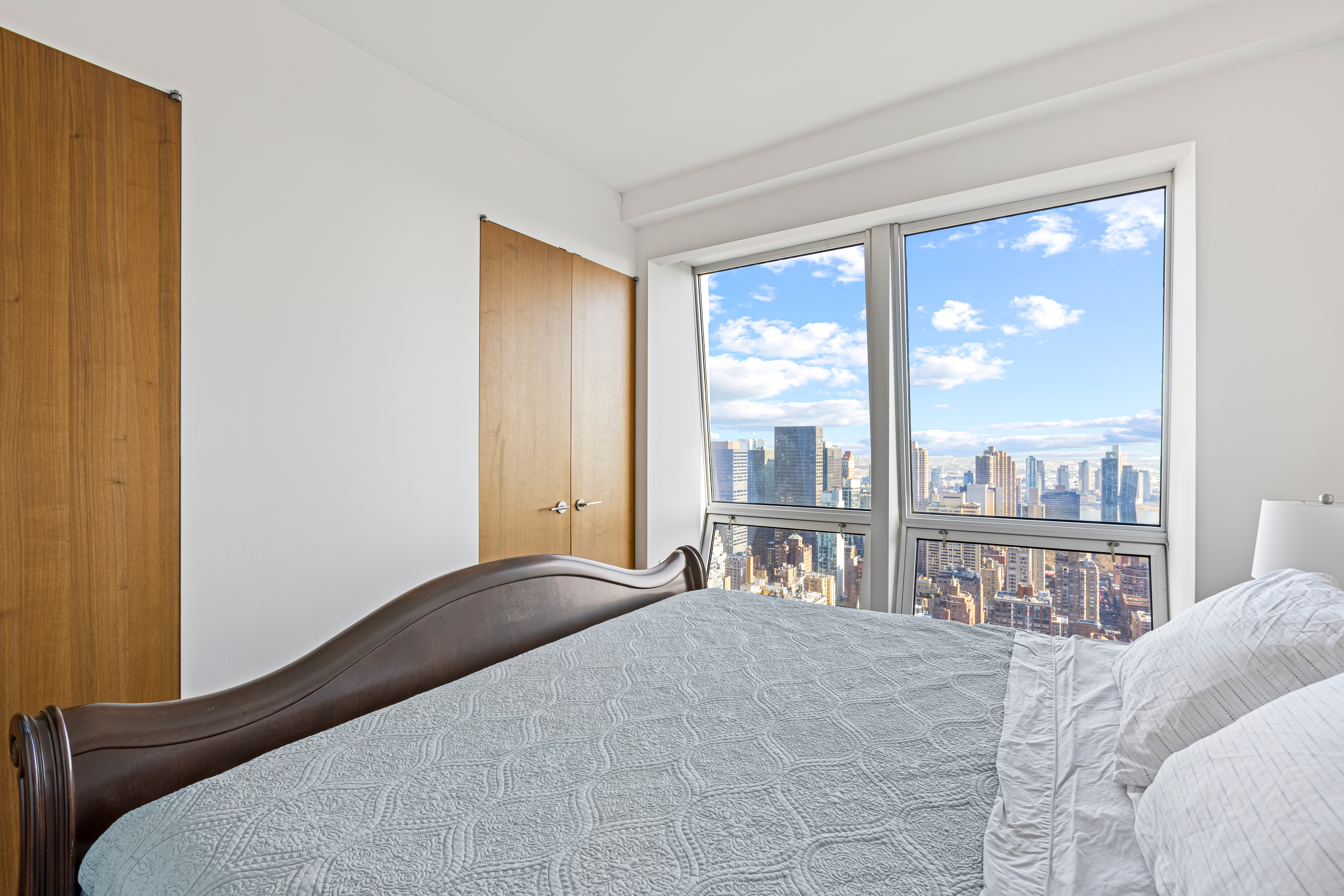 400 5th Avenue, Unit 49C Manhattan, NY 10018 - Photo 6 of 21 a bedroom with a large bed and a large window